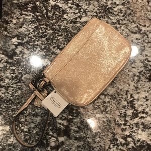 Coach wristlet shimmery light gold champagne.